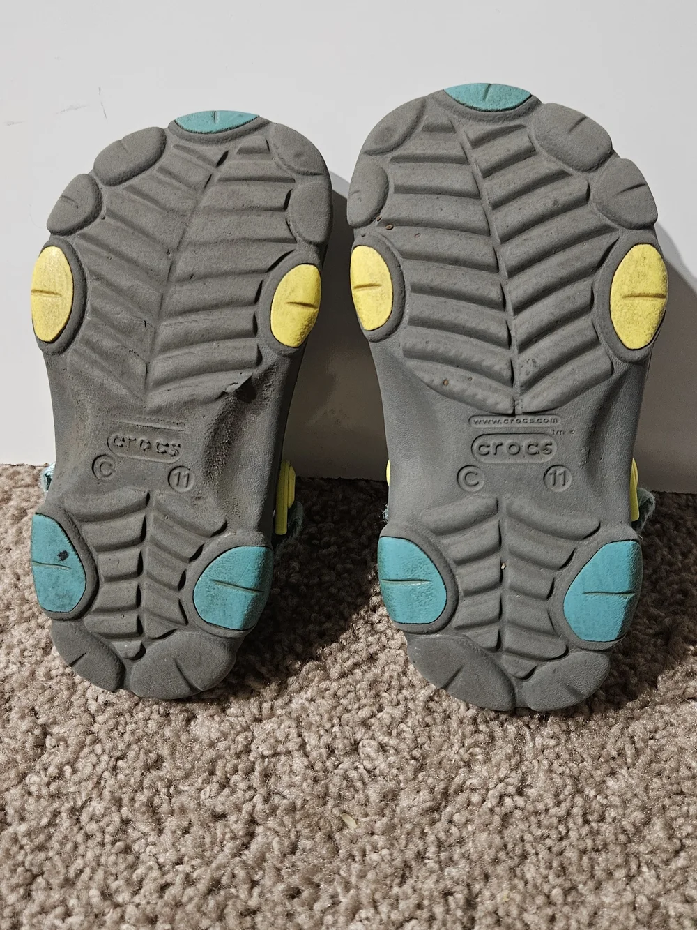 CROCS Kids Gray Clogs with Yellow and Blue Accents
